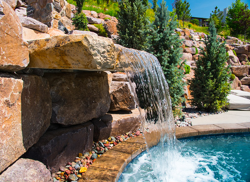 Rock waterfall into pool project