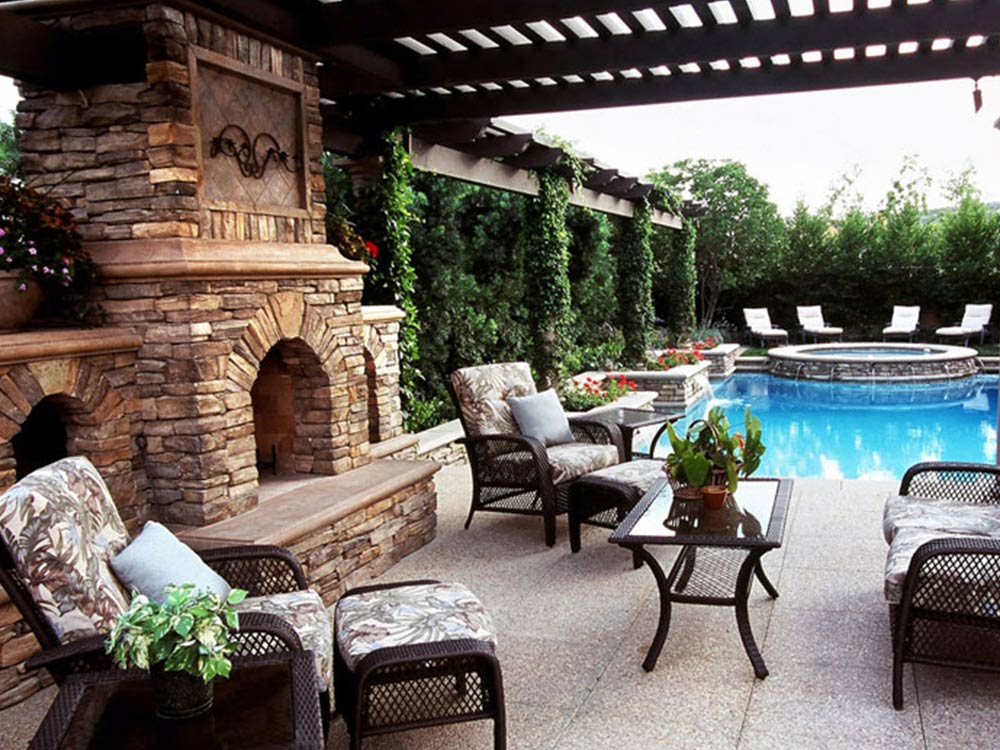 fire pit, stone outdoor fireplace, rock pool and hot tub